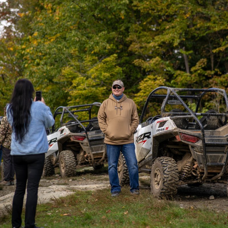 a group of people riding on the back of a truck